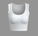 a woman ' s white sports bra top