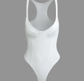 a white bodysuit on a gray background
