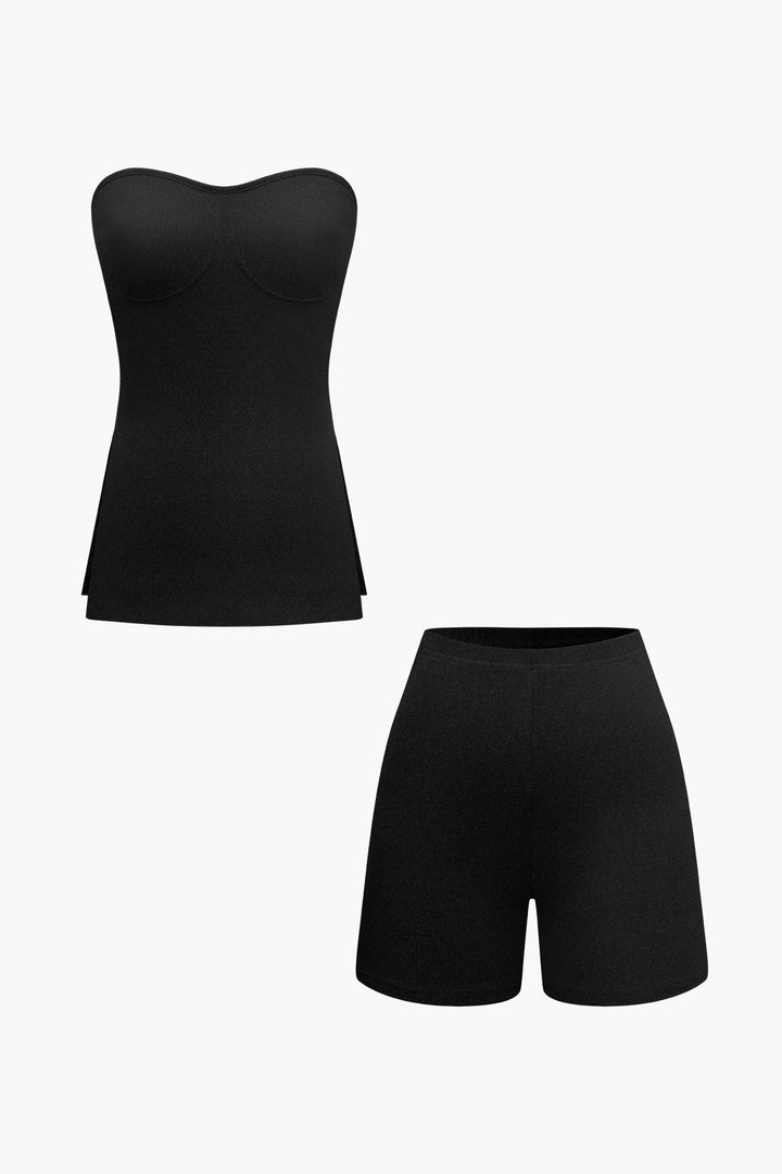 a woman wearing a black top and shorts