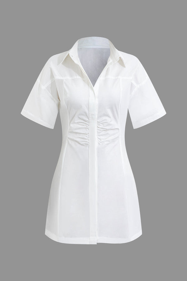 a white shirt with a bow on the front