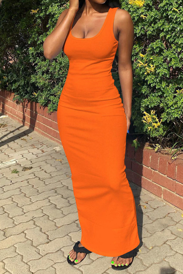 a woman wearing an orange maxie dress
