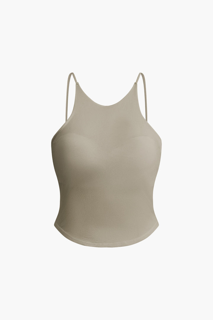 a woman wearing a beige bra bra top