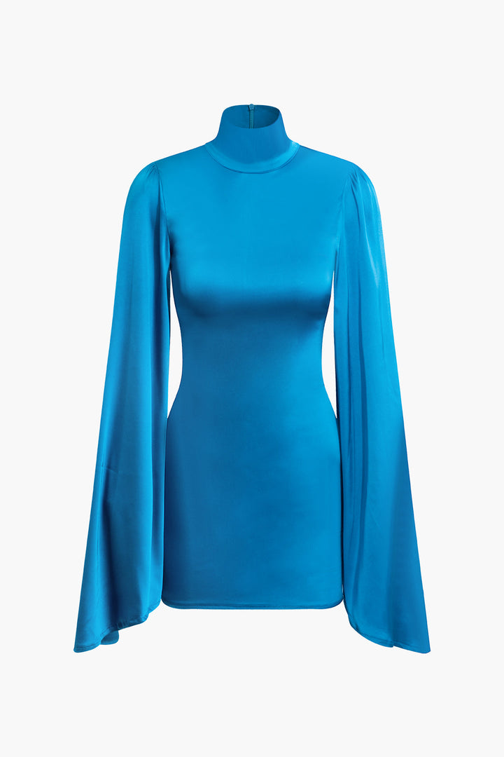a woman wearing a blue turtle neck top