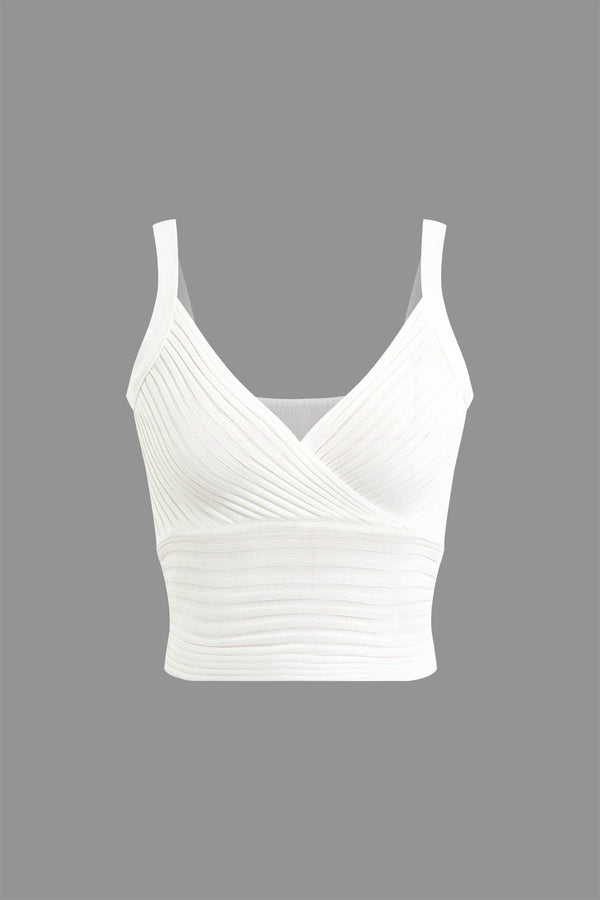a white crop top with plea detailing