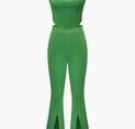 a woman wearing a green jumpsuit