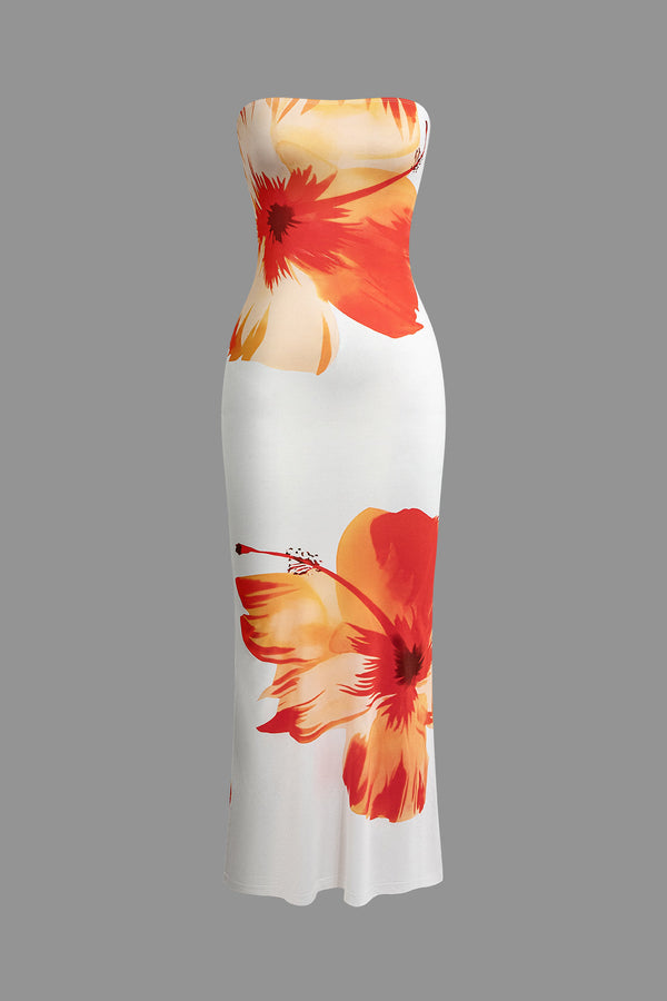 a white dress with orange flowers on it