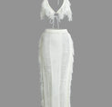 a white dress with fringes on the back