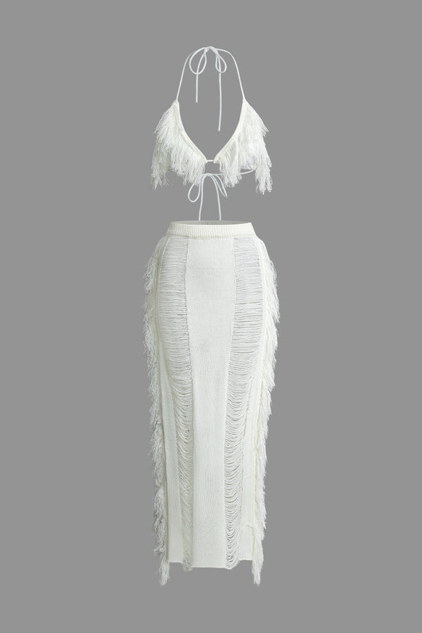 a white dress with fringes on the back