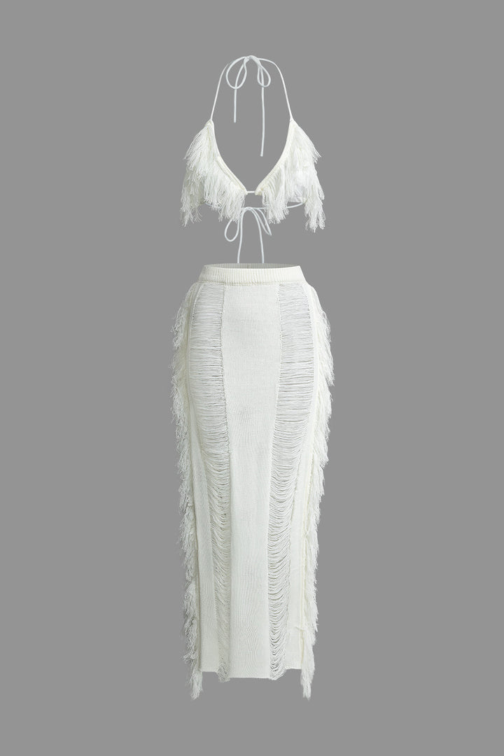 a white dress with fringes on the back
