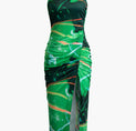a green and black dress with an abstract print