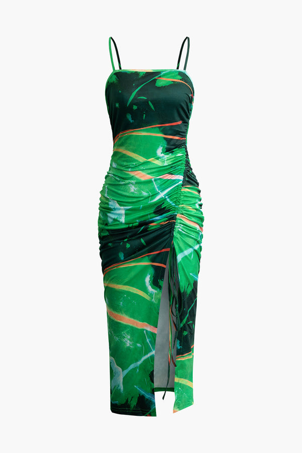a green and black dress with an abstract print