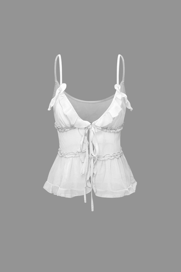 a white top with a bow on the front