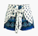 a white shorts with a blue paisley print on it