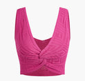 a pink crop top with a bow at the front