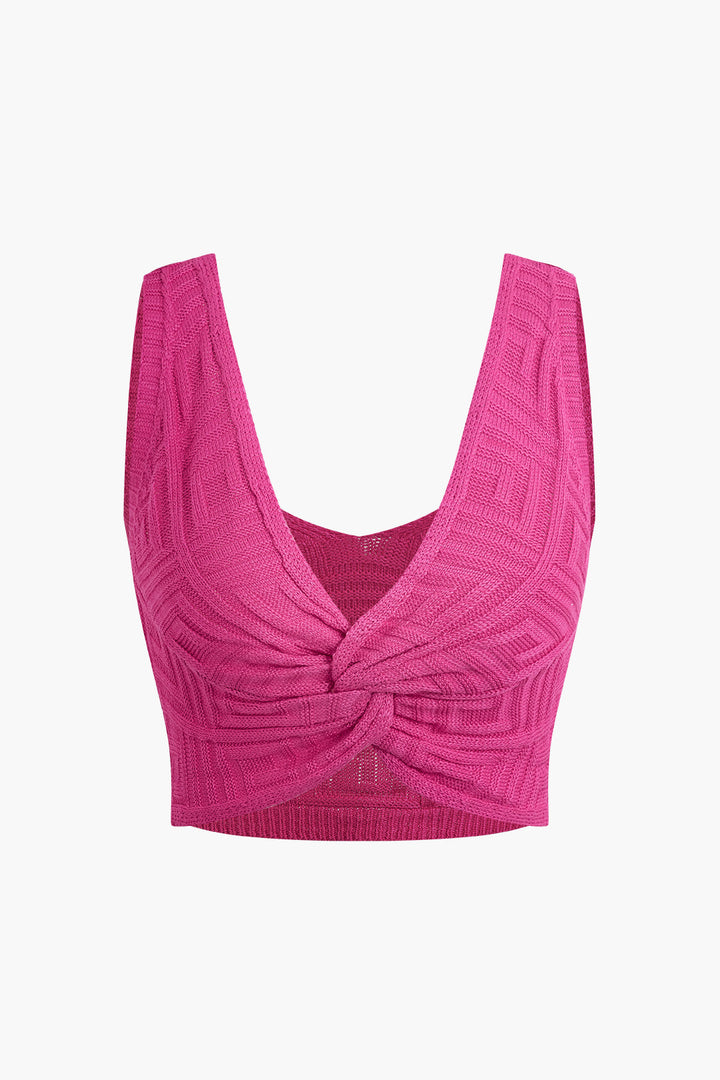 a pink crop top with a bow at the front
