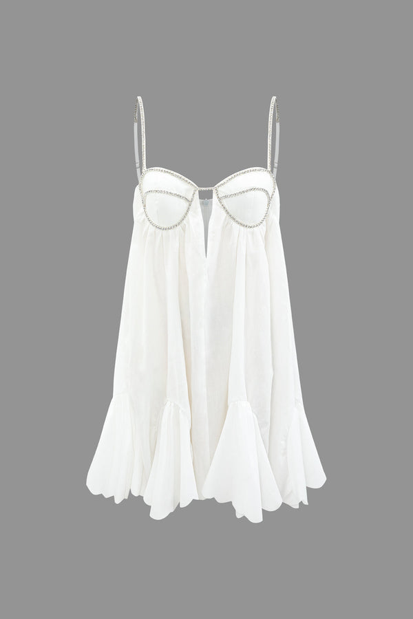 a white top with a beaded neckline