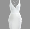 a white swimsuit with spaghetti straps