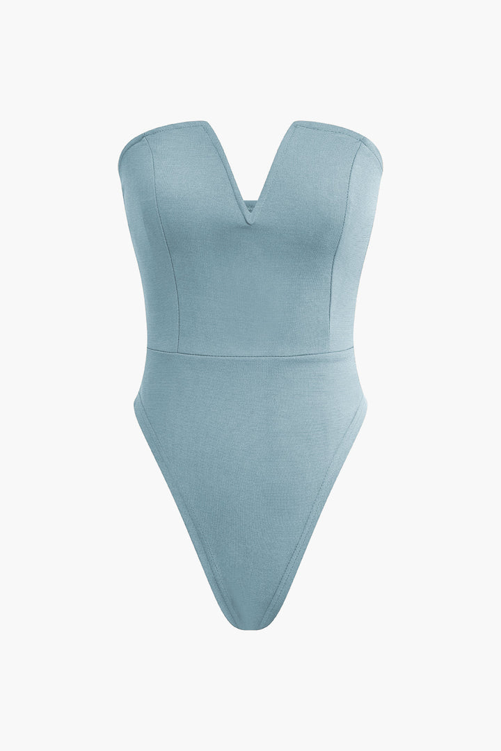 a light blue bodysuit with a v - neckline