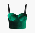 a green velvet bra top with black straps